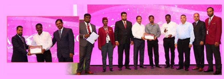 EFL staff holding award