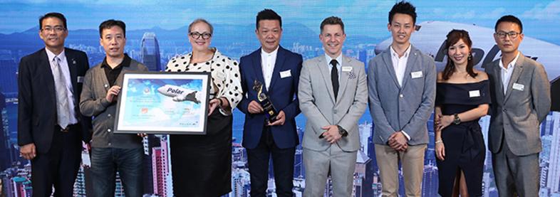 EFL staff holding award from Polar Air