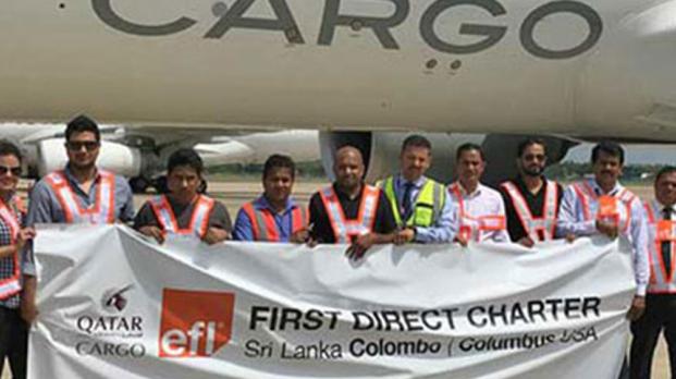 EFL staff in front of first charter cargo plane 