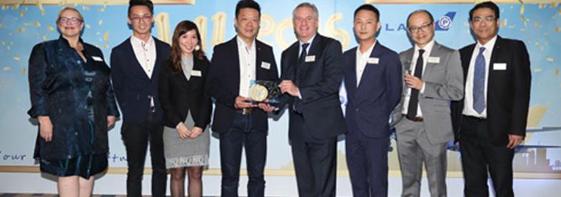 EFL staff holding award