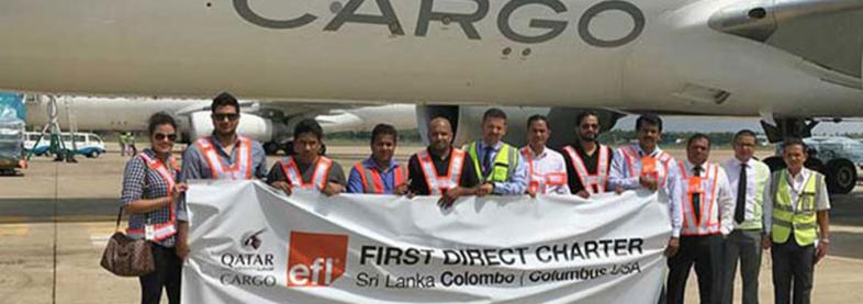 EFL staff in front of first charter cargo plane